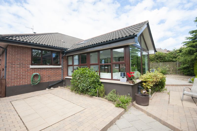 Completed Sunroom with Landscaping